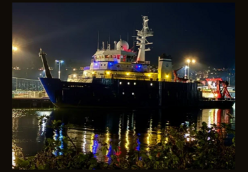 R/V Sikuliaq at the pier at night