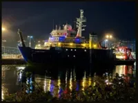 R/V Sikuliaq at the pier at night